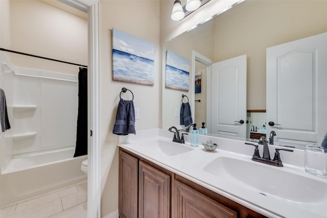 full bathroom featuring vanity, tile patterned floors, shower / bath combination with curtain, and toilet