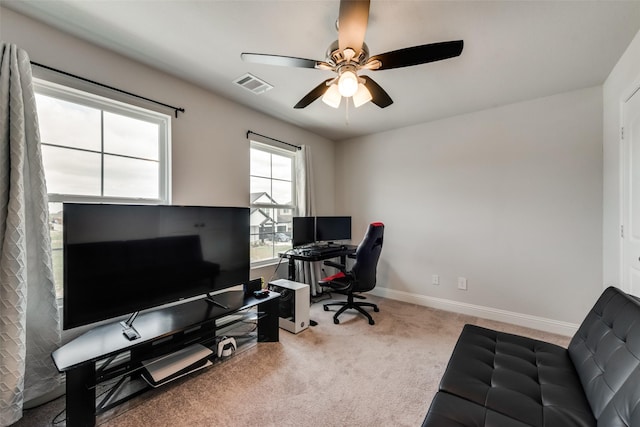 office with carpet flooring and ceiling fan