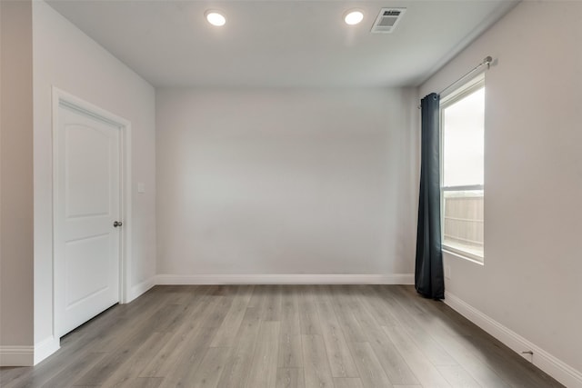 unfurnished room featuring light hardwood / wood-style floors