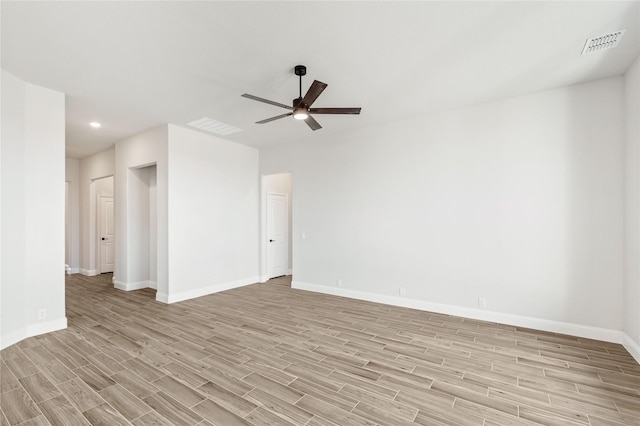 unfurnished room with ceiling fan and light hardwood / wood-style flooring