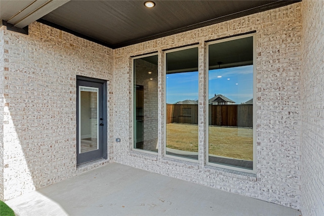 entrance to property featuring a patio