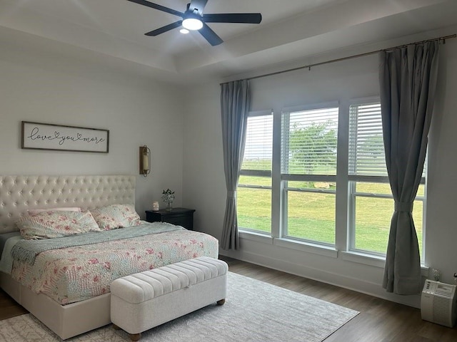192 Top Flight Dr, Weatherford, TX 76087 - bedroom featuring baseboards, a ceiling fan, a raised ceiling, and wood finished floors