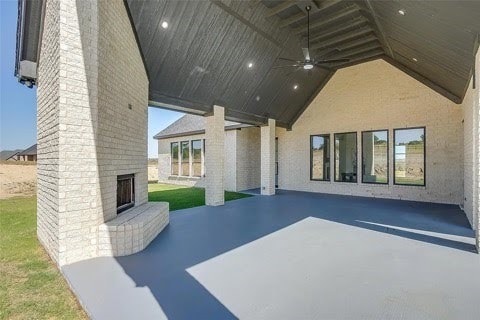 192 Top Flight Dr, Weatherford, TX 76087 - view of patio / terrace with a ceiling fan and an outdoor brick fireplace