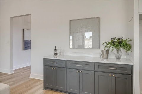 192 Top Flight Dr, Weatherford, TX 76087 - bar featuring light wood-type flooring and baseboards