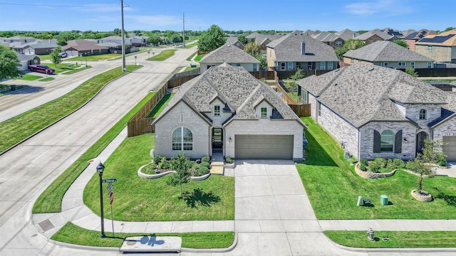 view of front of home with a front yard and a garage