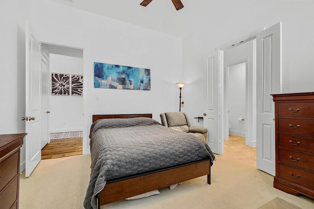 bedroom with ceiling fan and light colored carpet