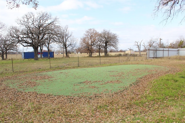 view of yard with a rural view