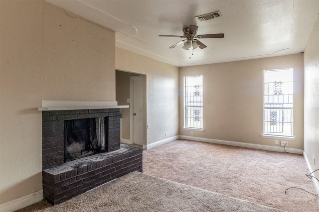 unfurnished living room with carpet flooring and a healthy amount of sunlight