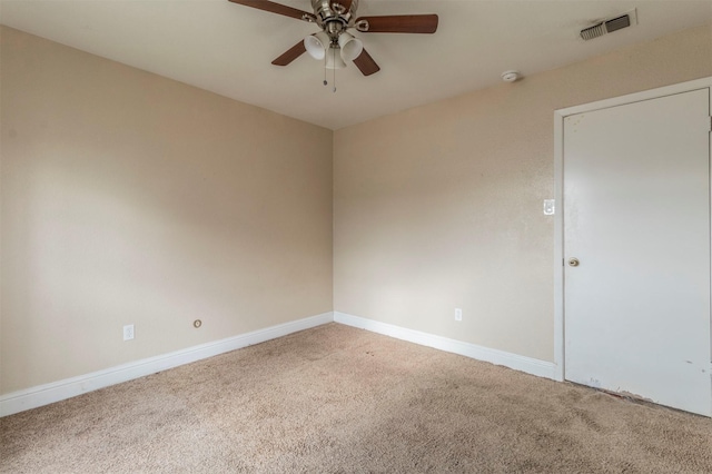 unfurnished room featuring ceiling fan and carpet floors