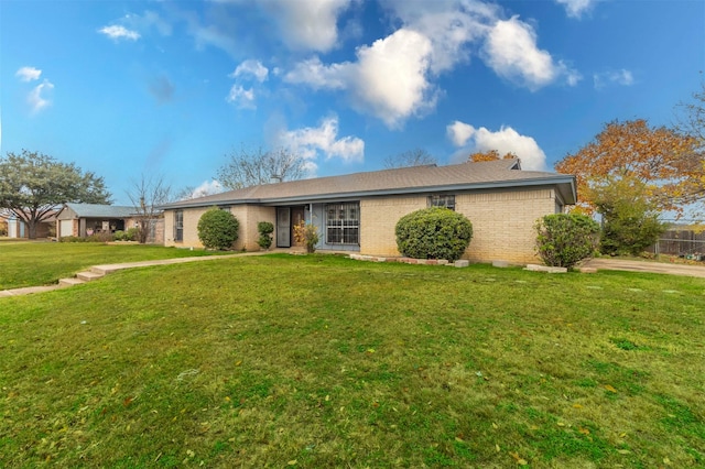 ranch-style house with a front lawn