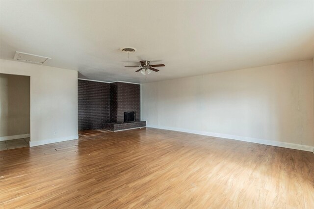 unfurnished living room with light wood-type flooring and ceiling fan