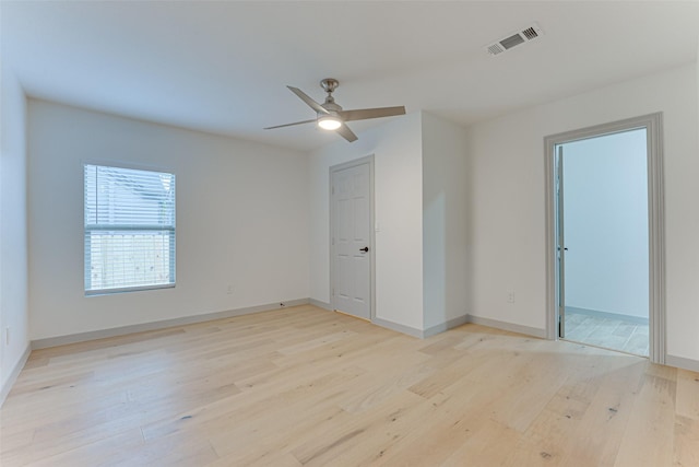 spare room featuring ceiling fan and light wood-type flooring