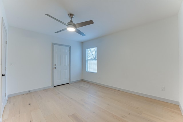 empty room with light hardwood / wood-style flooring and ceiling fan