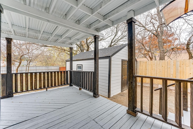 wooden terrace with a shed