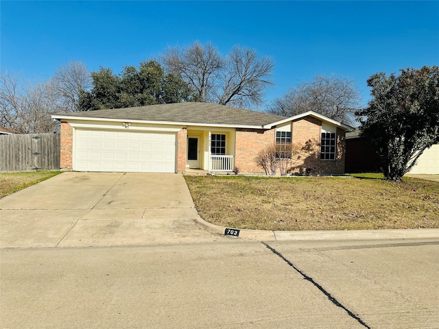 ranch-style home featuring a garage and a front lawn