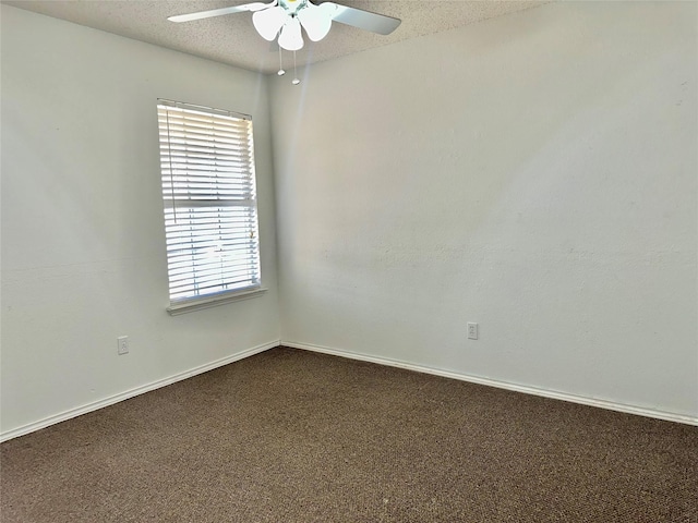 carpeted spare room with ceiling fan and a textured ceiling