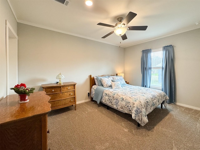 carpeted bedroom featuring ceiling fan and crown molding