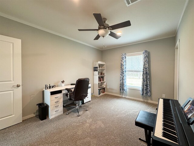 carpeted office space with ceiling fan and ornamental molding