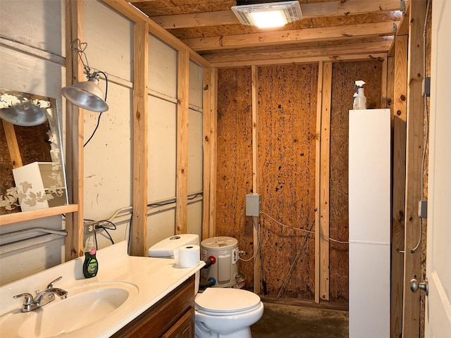 bathroom with vanity, toilet, and wooden walls