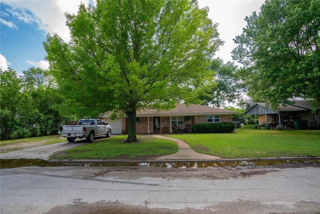 ranch-style home featuring a front yard