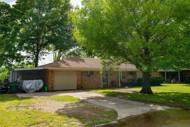 single story home with a garage and a front lawn