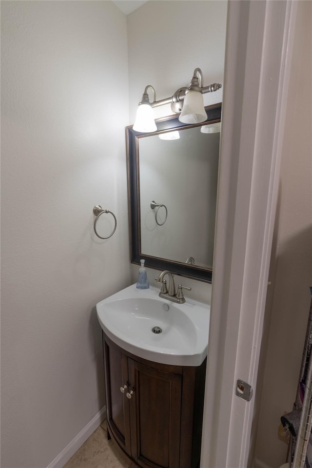 bathroom featuring tile patterned flooring and vanity