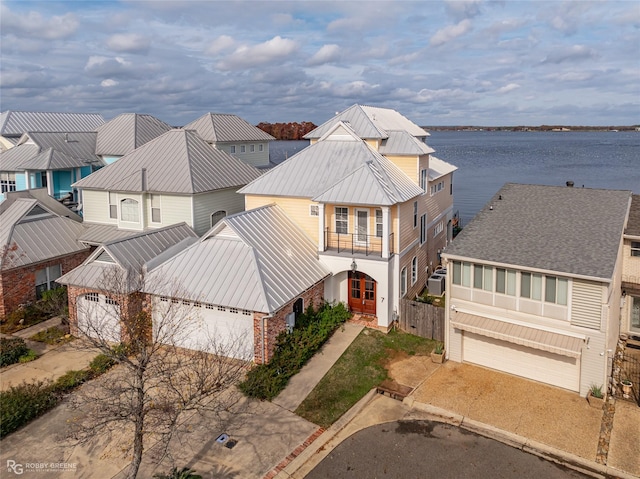 birds eye view of property with a water view