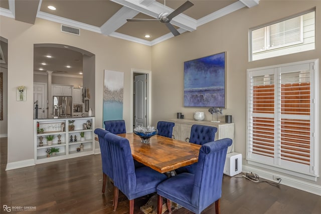 dining space featuring coffered ceiling, ceiling fan, crown molding, dark wood-type flooring, and beam ceiling