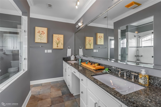 bathroom featuring toilet, vanity, ornamental molding, and walk in shower