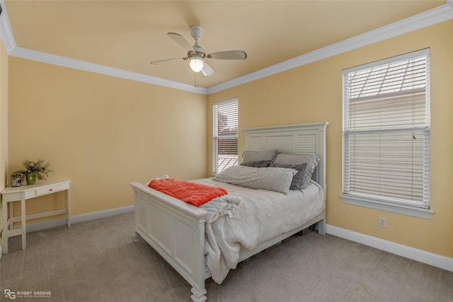 carpeted bedroom featuring ceiling fan, ornamental molding, and multiple windows