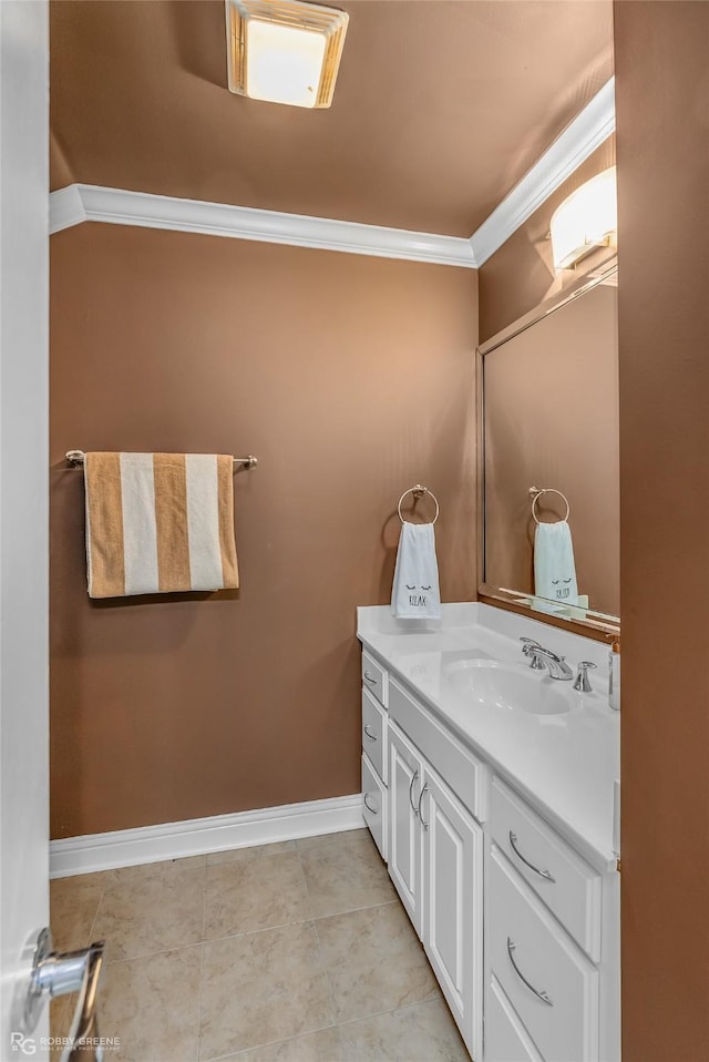 bathroom with ornamental molding, tile patterned floors, and vanity