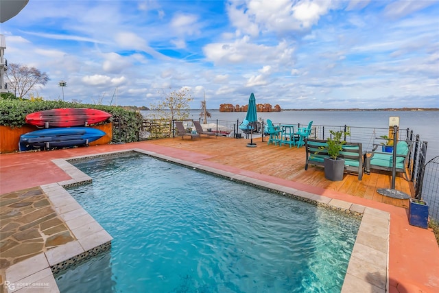 view of swimming pool with a deck with water view