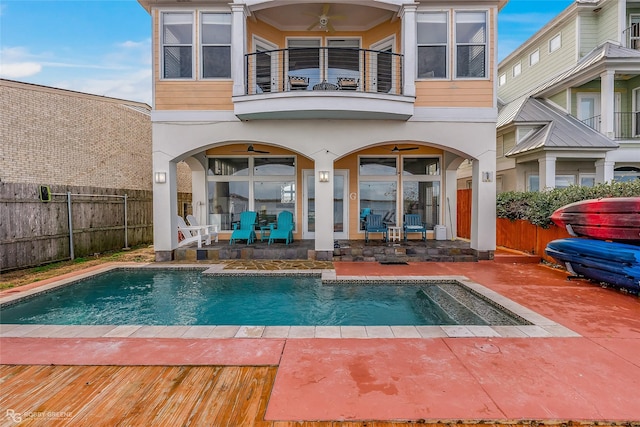 exterior space featuring ceiling fan, a patio area, and a balcony