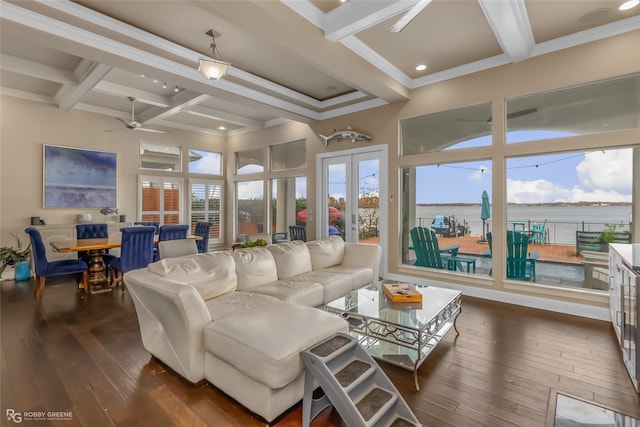 living room with beam ceiling, a water view, dark hardwood / wood-style floors, and coffered ceiling