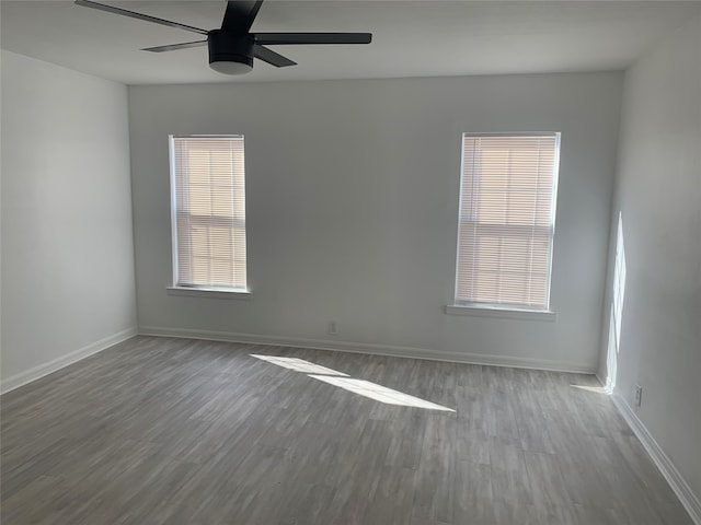 spare room featuring ceiling fan and hardwood / wood-style flooring