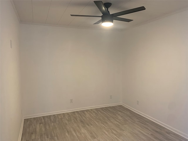 spare room featuring ceiling fan and hardwood / wood-style flooring