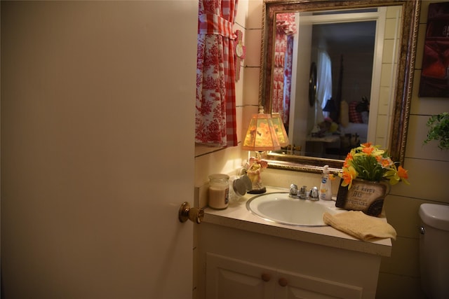 bathroom with vanity and toilet