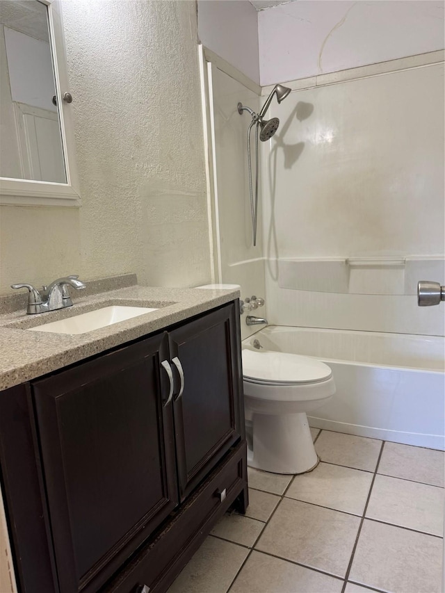 full bathroom featuring tile patterned flooring, vanity, toilet, and shower / washtub combination