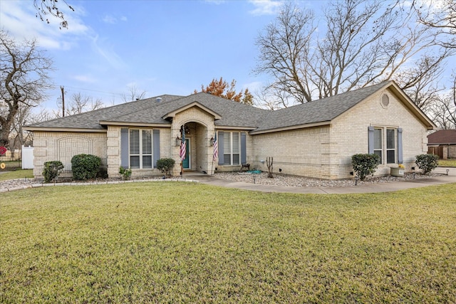 ranch-style home featuring a front yard