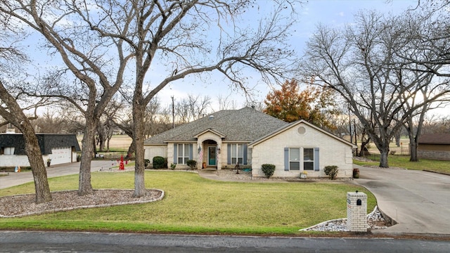 ranch-style home with a front yard