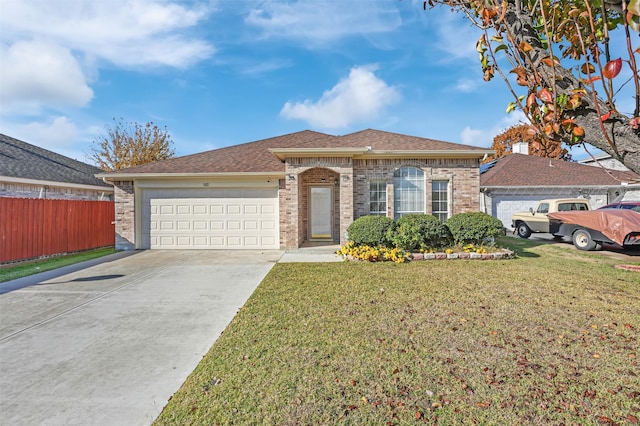 view of front facade with a front yard and a garage