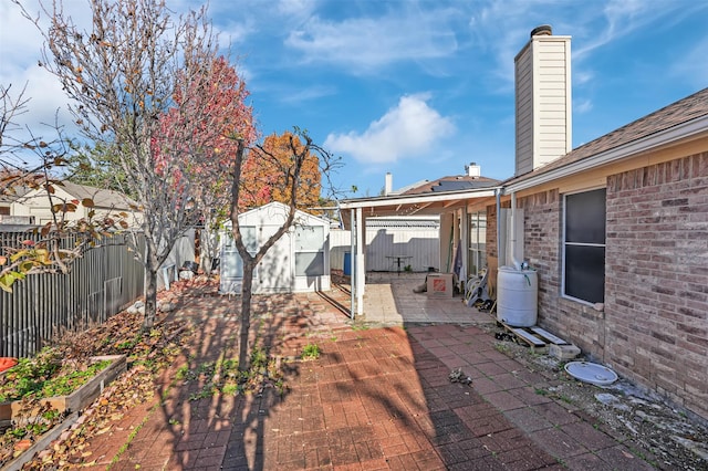 view of patio / terrace featuring a shed