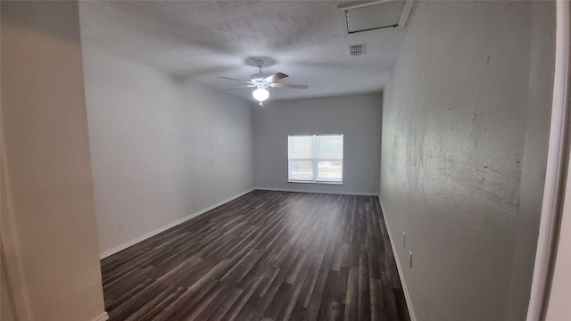 empty room with ceiling fan and dark hardwood / wood-style floors