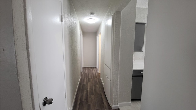 hall with dark hardwood / wood-style floors