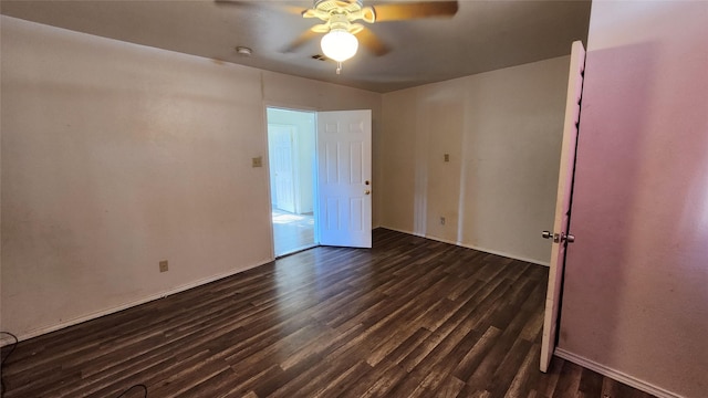 unfurnished room featuring dark hardwood / wood-style flooring and ceiling fan