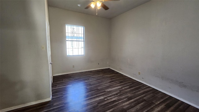 spare room with ceiling fan and dark hardwood / wood-style floors