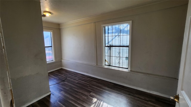 unfurnished room featuring dark hardwood / wood-style floors