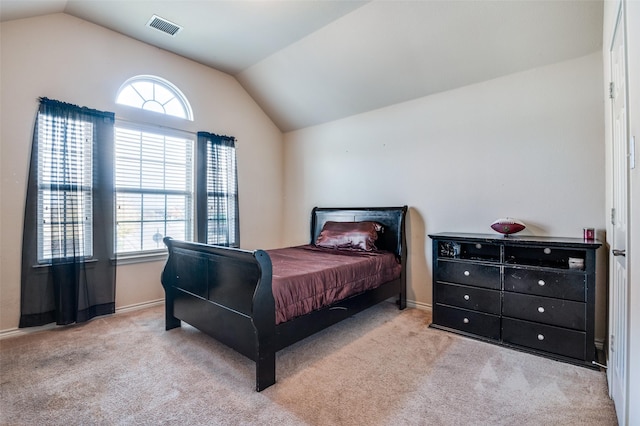 carpeted bedroom featuring vaulted ceiling