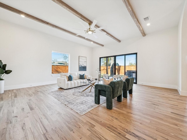 living room with light wood-type flooring, beam ceiling, and ceiling fan