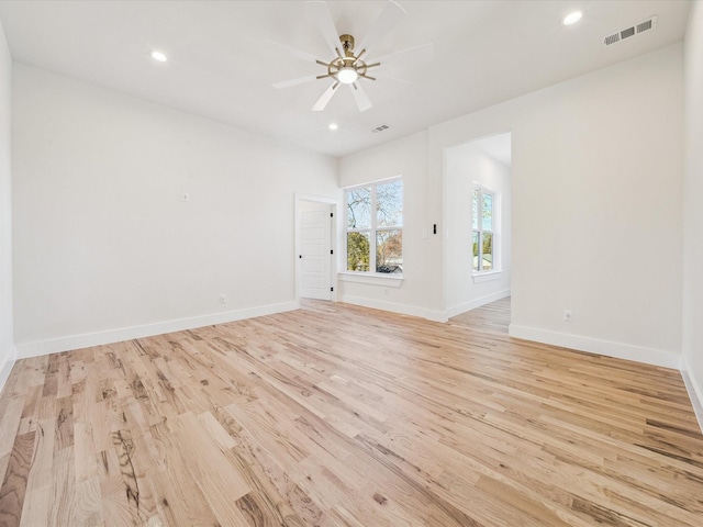 spare room featuring ceiling fan and light wood-type flooring